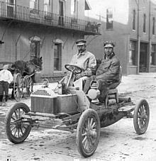 Buick's chief engineer, Walter L. Marr (left), and Thomas D Buick, son of founder David Dunbar Buick, in the first Flint Buick as it ended its successful Flint-Detroit round trip in July, 1904.